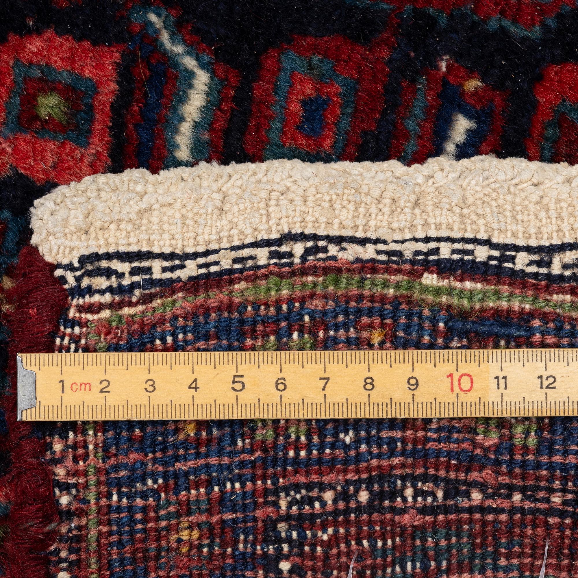 A semi-antique Bidjar carpet, c. 310 x 145 cm.