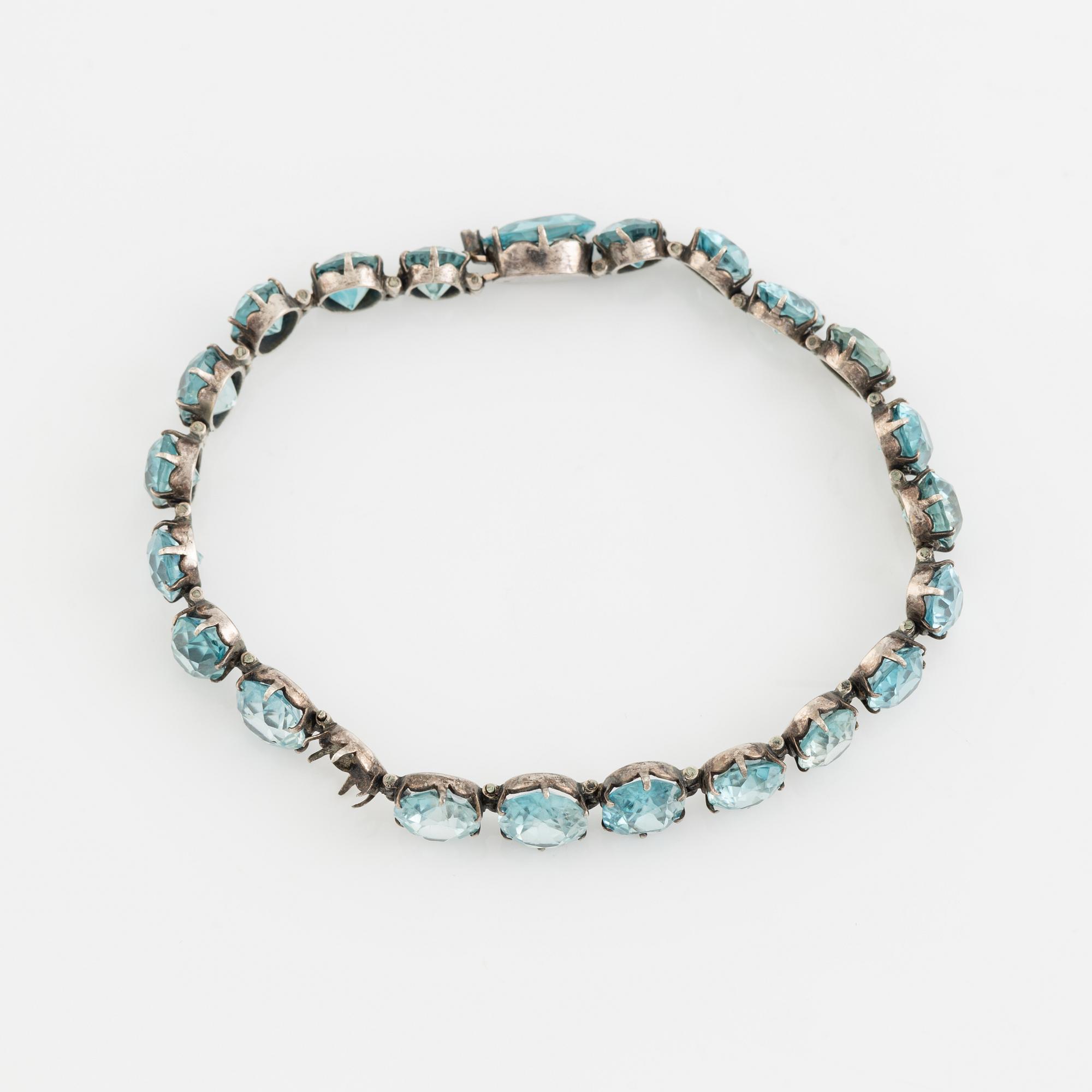 Silver and blue zircon bracelet.