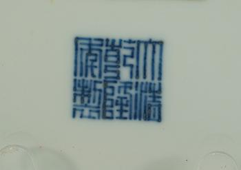 A yellow glazed dish, Qing dynasty, with Qianlong seal mark.