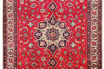 An oriental carpet, c. 385 x 300 cm.