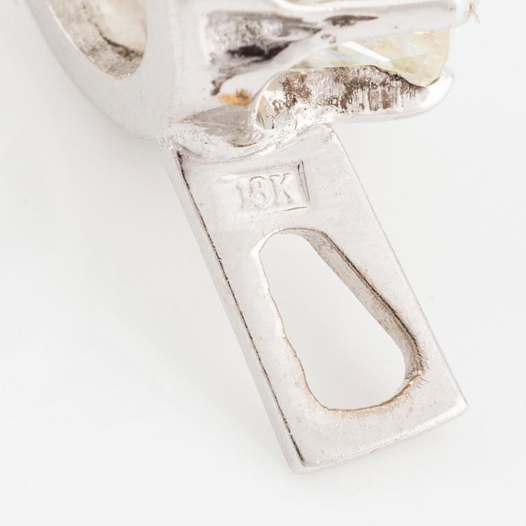 An 18K gold pendant with an old-cut diamond.