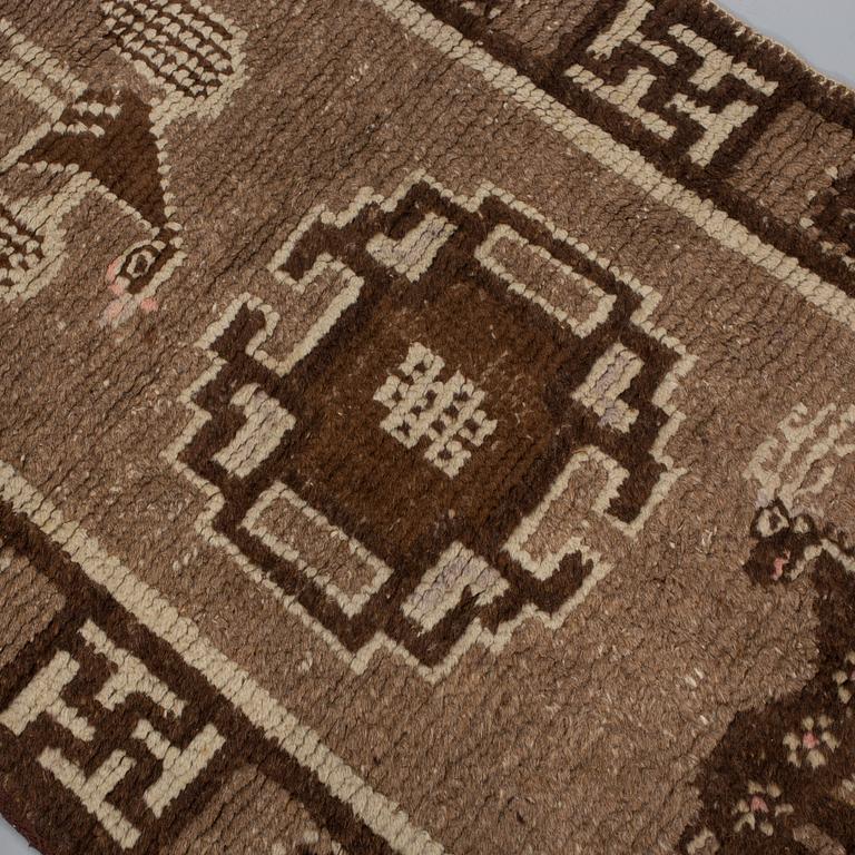 A RUG, a semi-antique Tibetan probably, ca 158 x 78 cm.