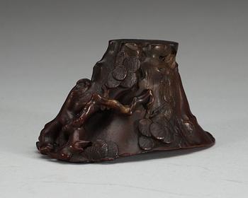 A carved rhinoceros libation cup, Qing dynasty, 18th Century.