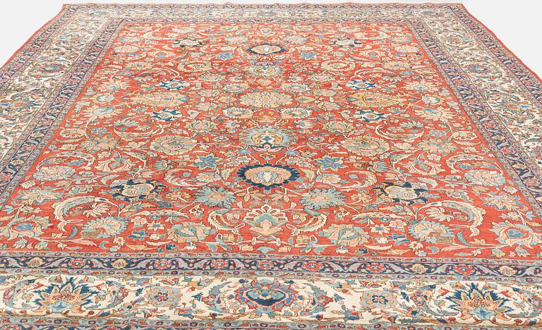 A carpet, semi-antique, Qum, ca 433 x 323 cm.