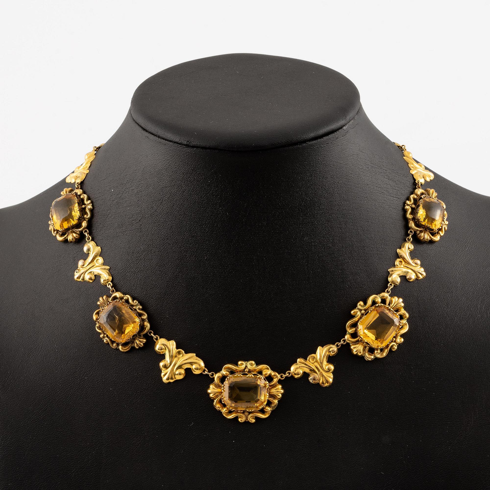 A necklace and a pair of earrings in 14K gold with faceted citrines.