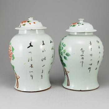 A pair of Chinese famille rose vases with covers, 20th century.