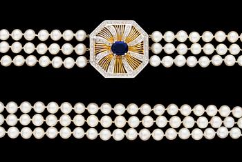 678. A cultured threestrand pearl necklace with 18k gold sapphire and diamond clasp.