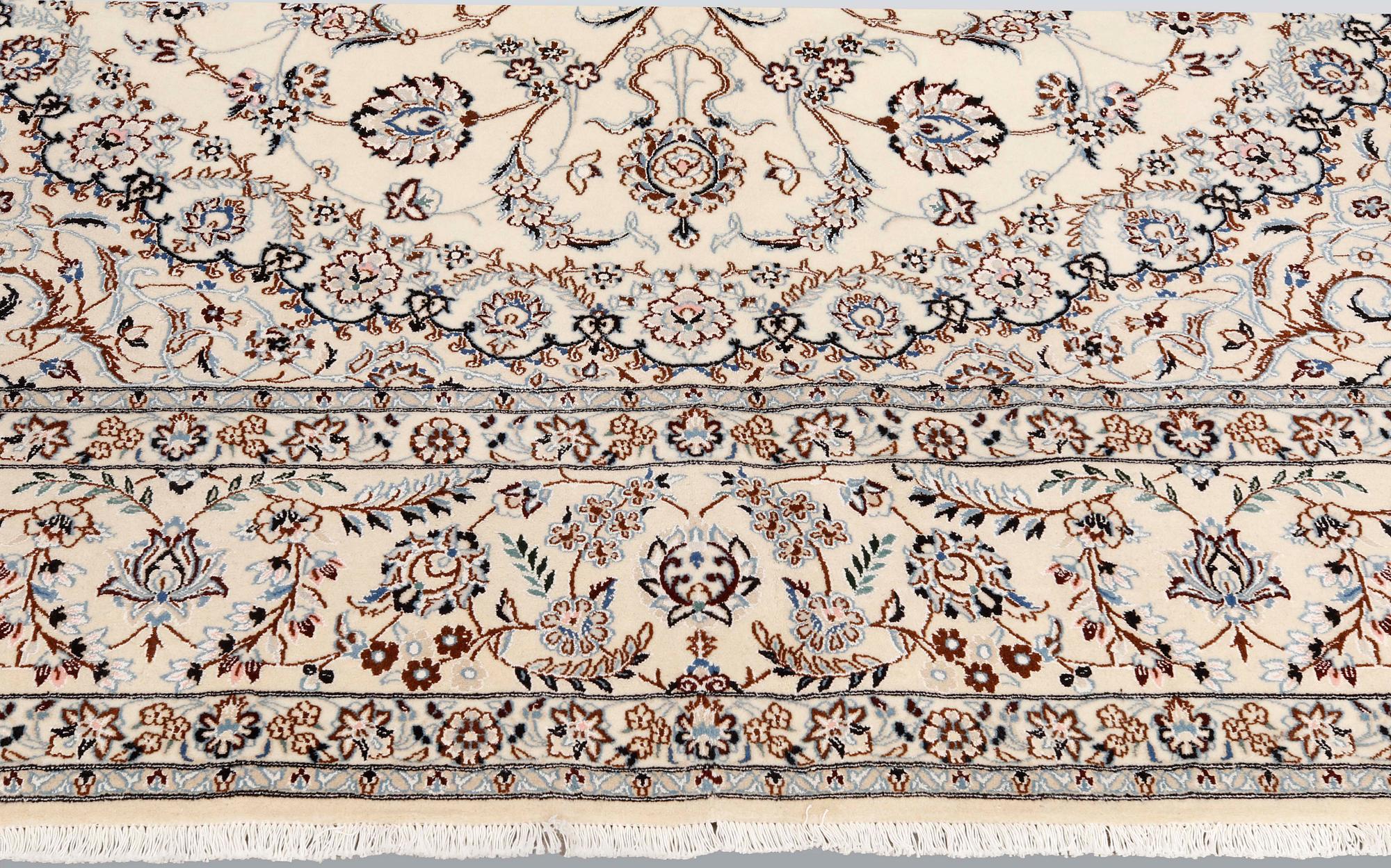 A Nain part-silk carpet, 395 x 293 cm.