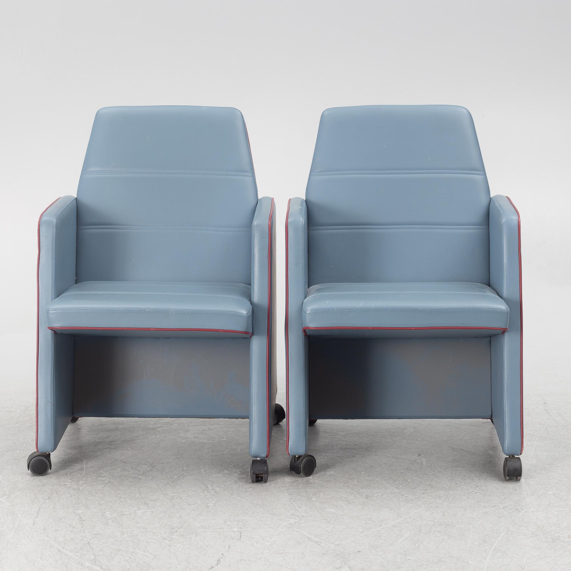 A pair of 1980s armchairs.