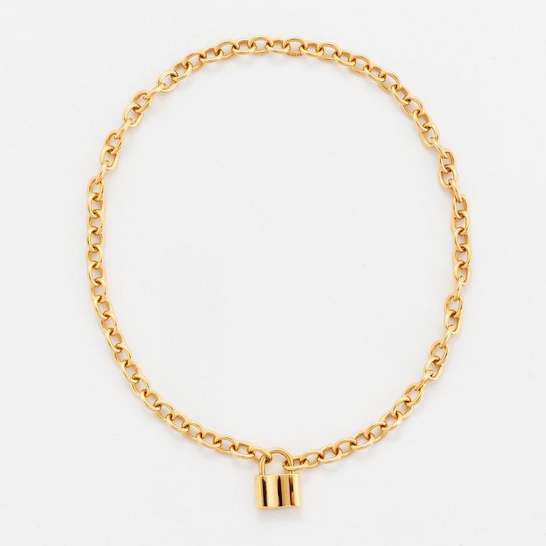 A Tiffany lock charm pendant necklace "1837" in 18K gold.