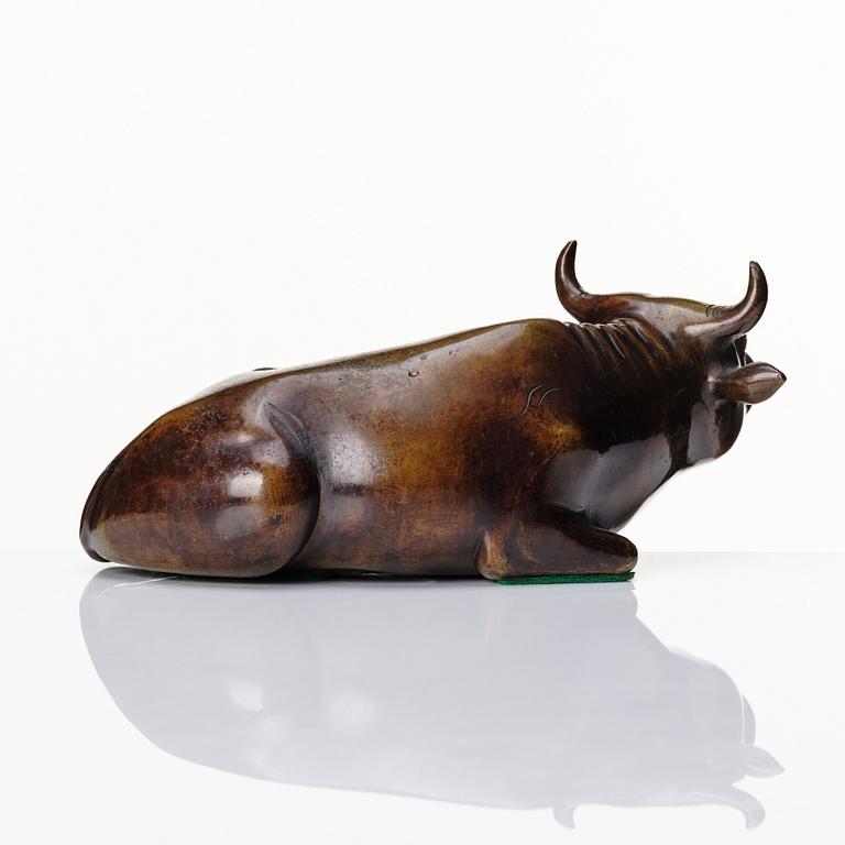 A bronze sculpture of a reclining buffalo, Qing dynasty, 19th Century.