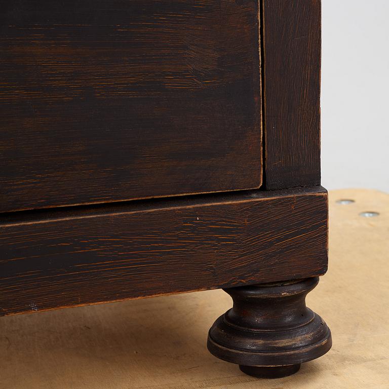 A chest of drawers, circa 1900.