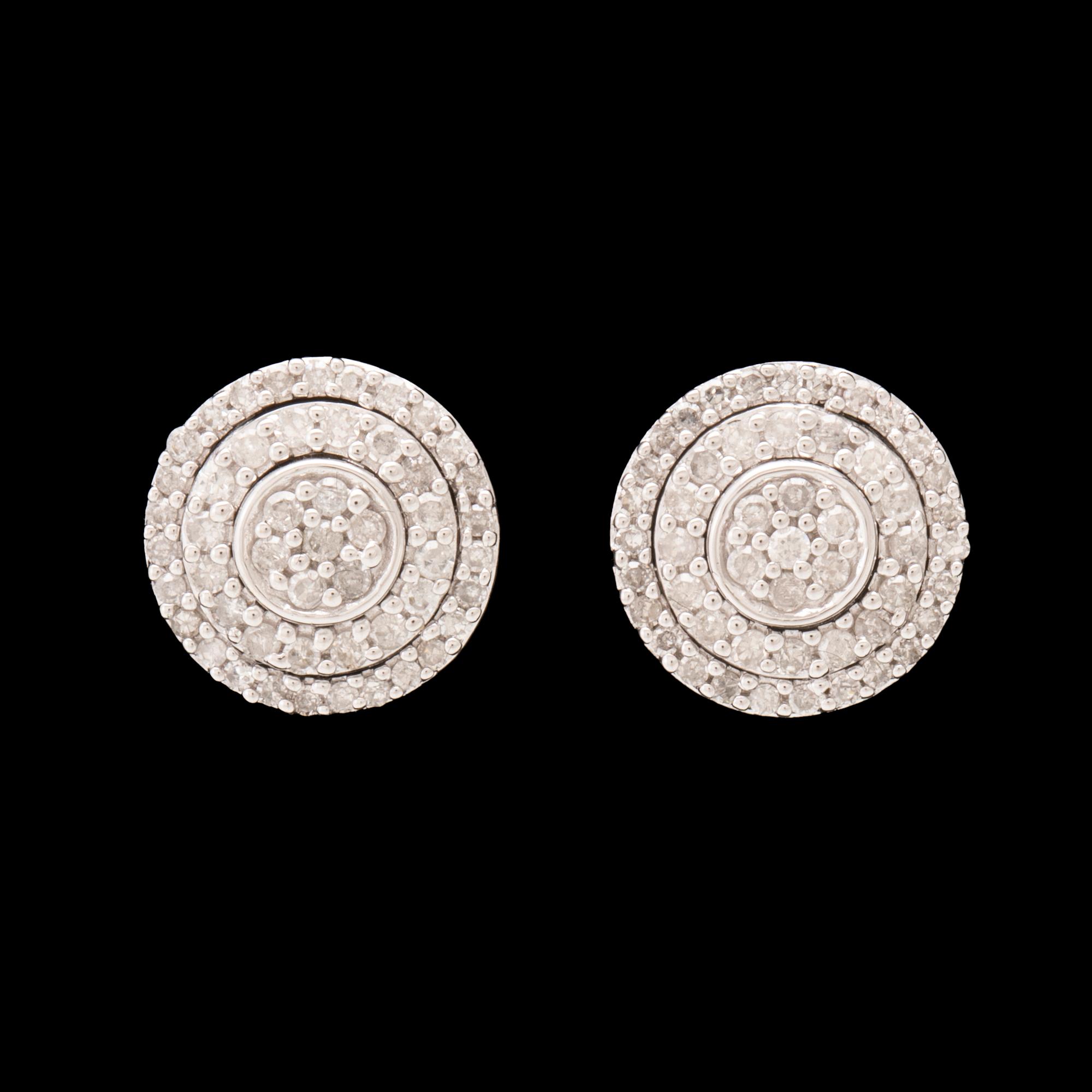 A pair of 14K white gold earrings set with round single-cut diamonds.