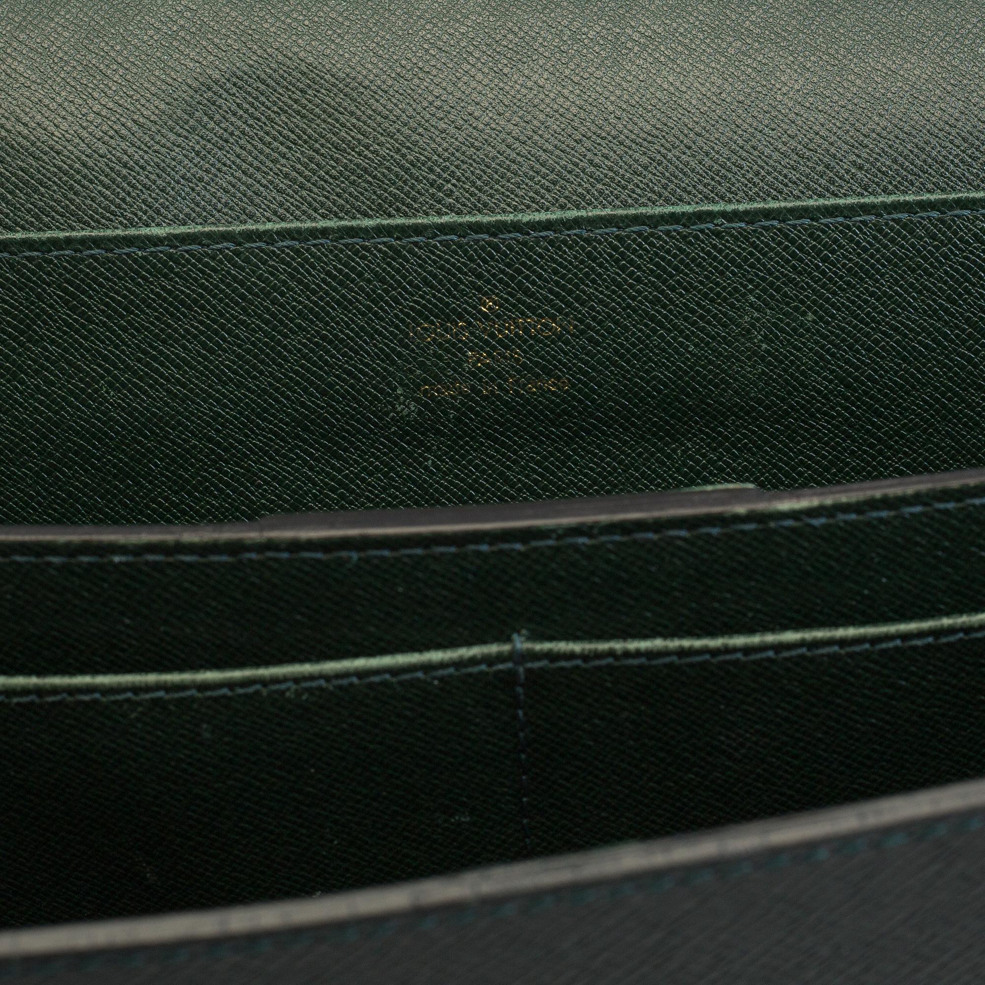 A Louis Vuitton green taiga Ambassador Briefcase.