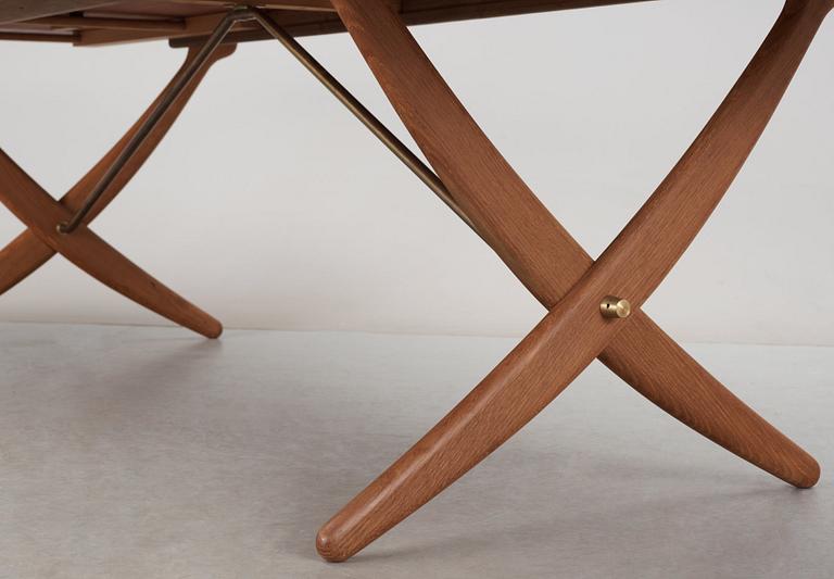 A Hans J Wegner teak and oak sabre leg dinner table by Andreas Tuck, Denmark 1950-60's.