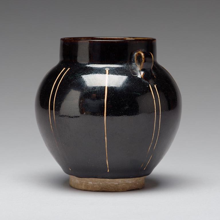 A Henan black glazed ribbed jar, Song dynasty (960-1279).