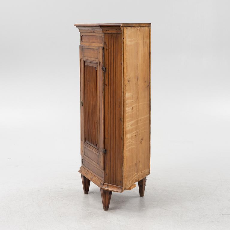 A Gustavian style pinewood corner cupboard, 19th Century.