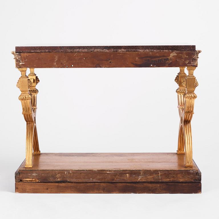 An Empire giltwood and 'Blyberg' porphyry console in the manner of J. Frisk, Stockholm early 19th century.