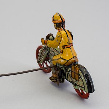 A tinplate Huki roundabout motorcycle, Germany, 1930s.