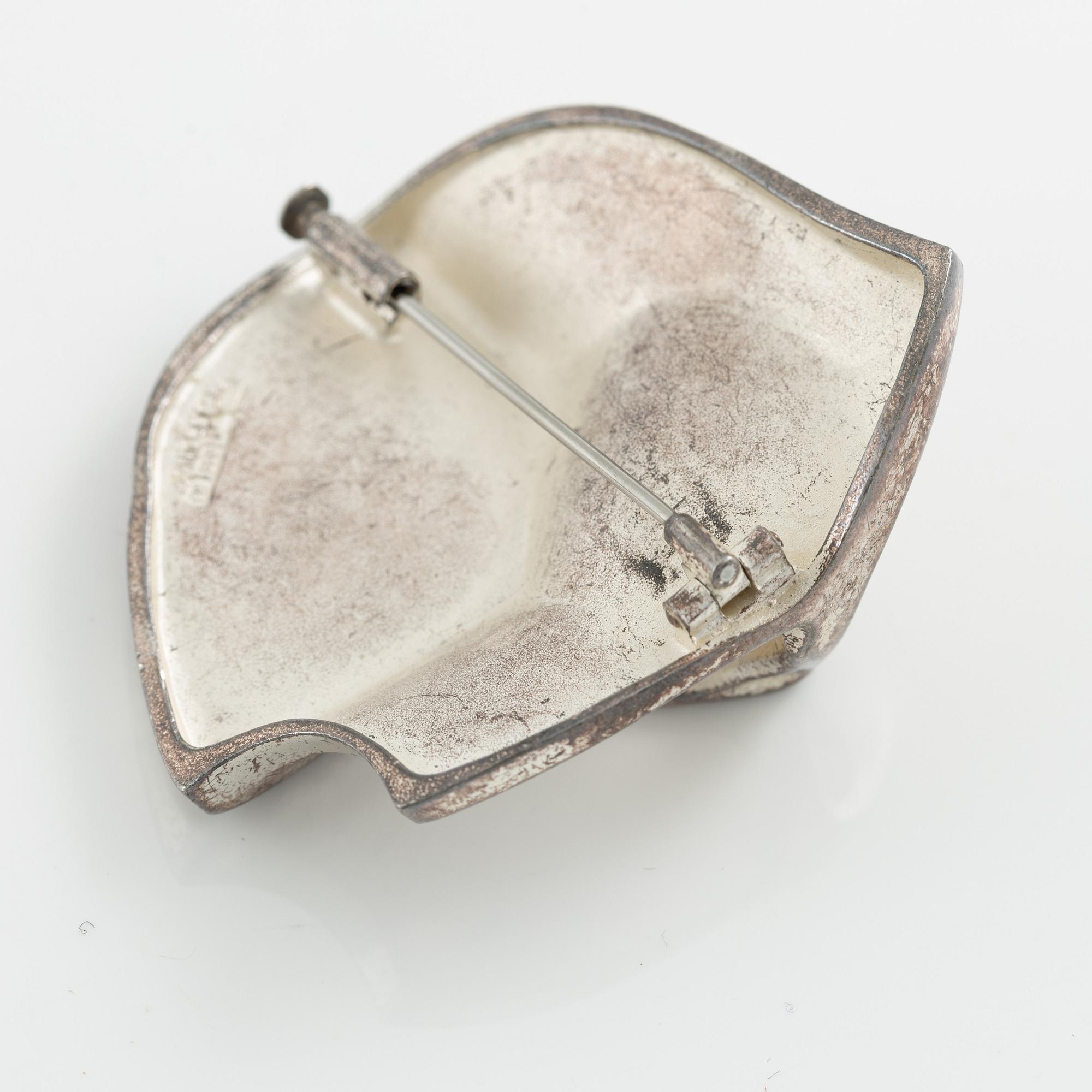 Lapponia a necklace, a pair of earrings and a brooch, sterling silver.