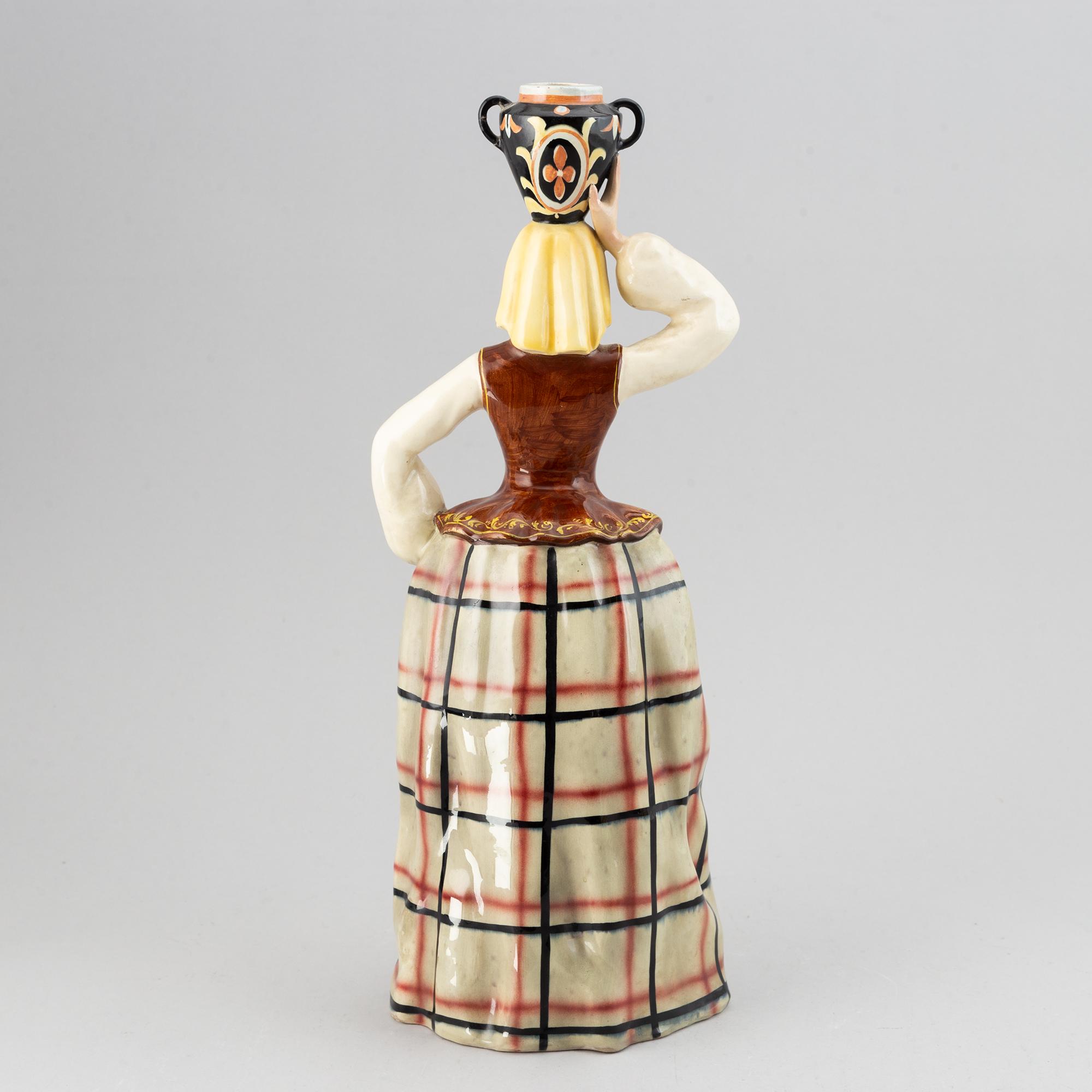 An Italian glazed ceramic sculpture of a water carrier and a wall sculpture, probably mid 20th century.