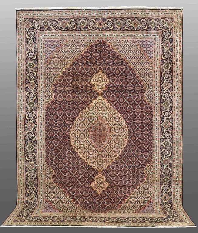 A CARPET, Tabriz part silk , so called 40 Radj, ca 298 x 202 cm.
