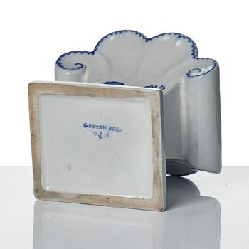 Wilhelm Kåge, eleven pieces of faience including jars, inkwells and a tulip vase, Gustavsberg, Sweden, 1919-1920.
