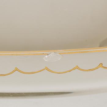 A glass punch bowl with eight jugs and turning dish, mid 19th century.