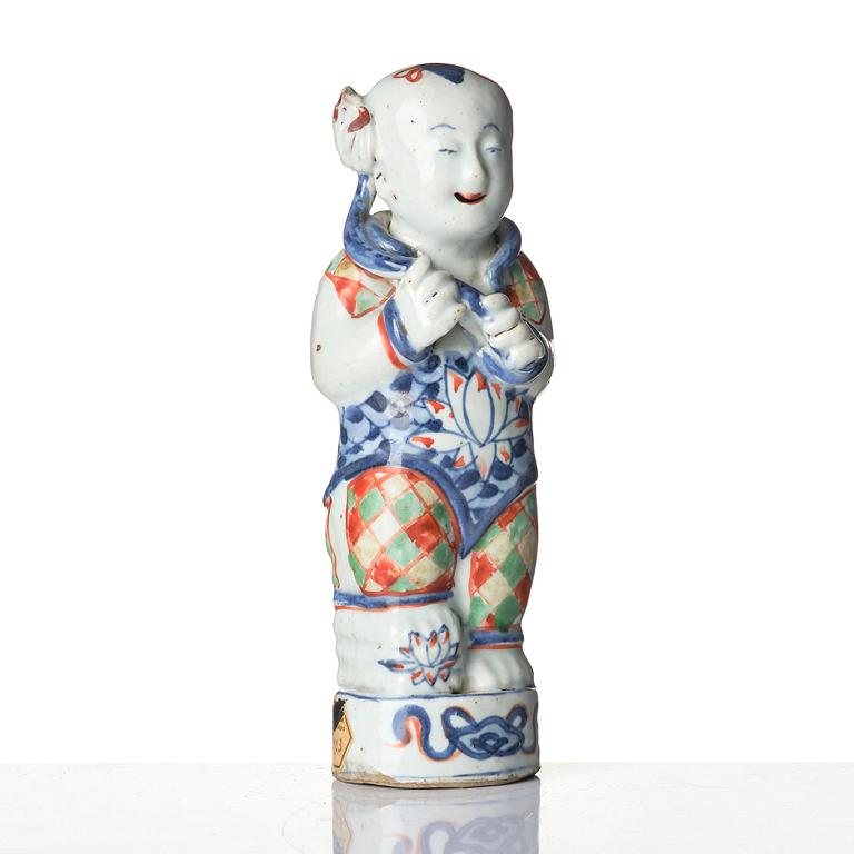 Three Chinese famille verte figures of laughing boys 'Hehe Erxian', 18th century.