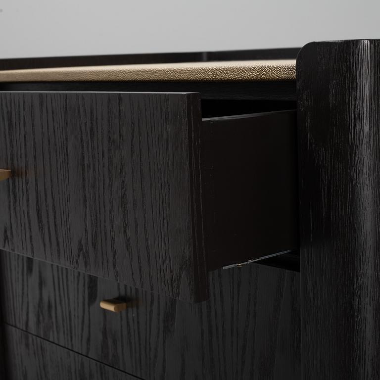 A black stained oak veneered 'Milano' dresser with top covering of faux stingray skin.