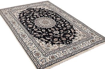 A carpet, Nain, part silk, ca 307 x 198 cm.