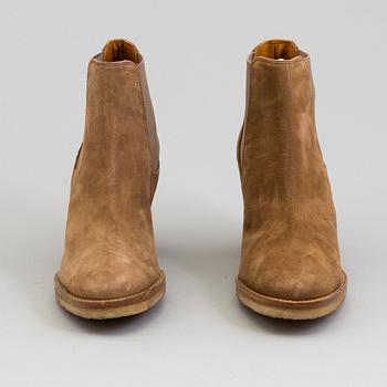 A pair of suede bootie byRalph Lauren.