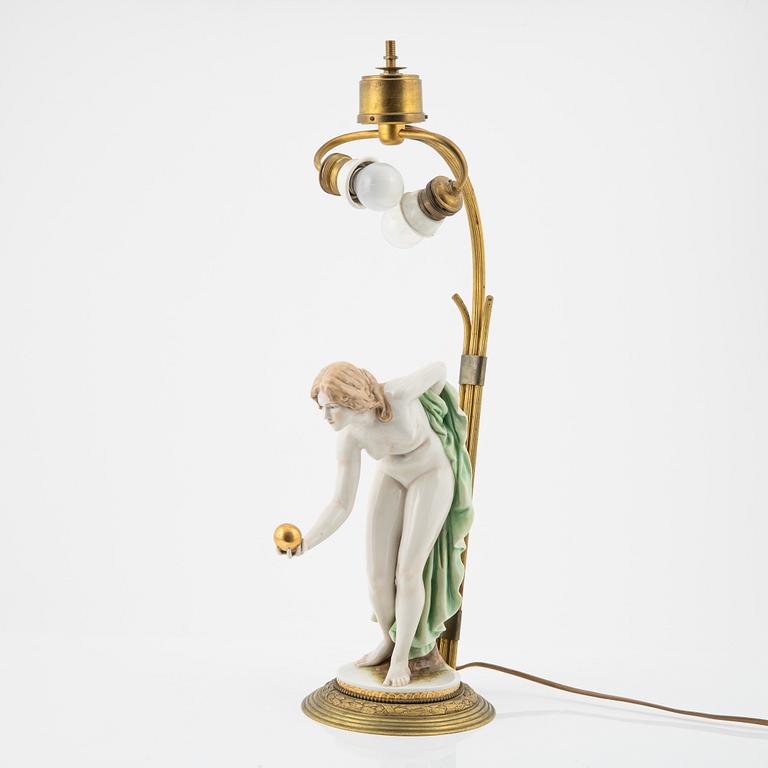 Walter Schott, an early 20th century porcelaine and brass table lamp.