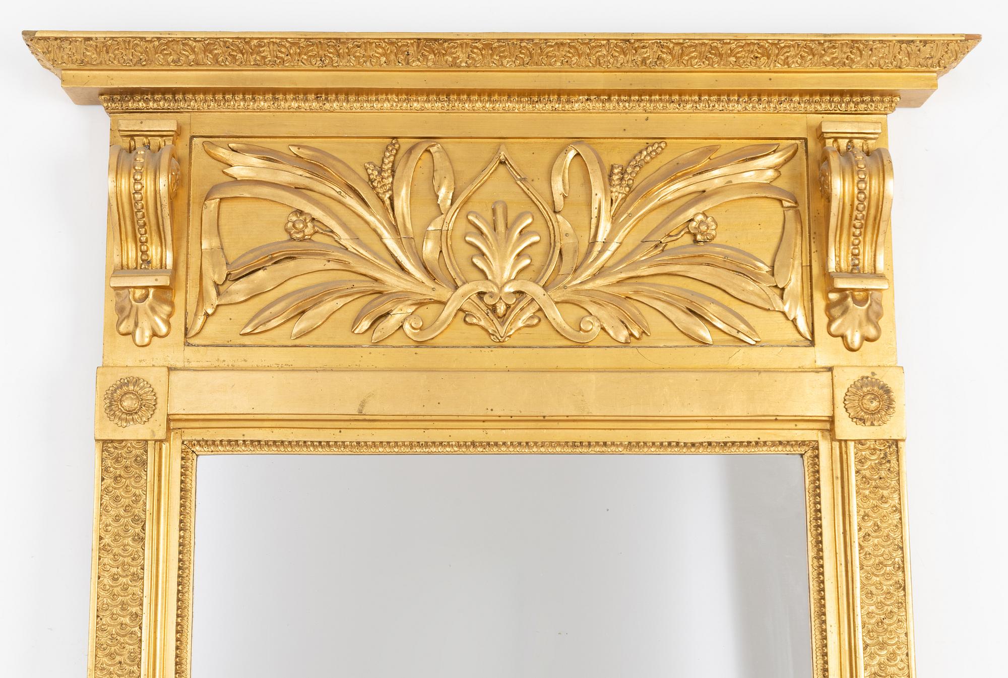 An Empire mirror, first half of the 19th century.