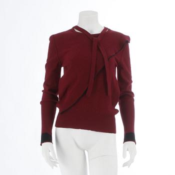 SONIA RYKIEL, a burgundy red wool sweater.