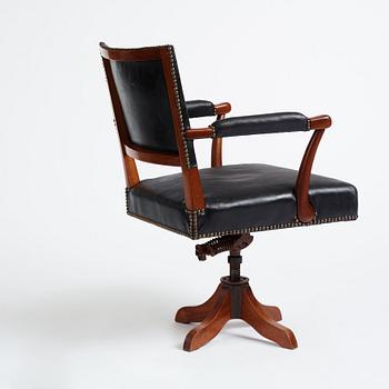 Josef Frank, a mahogany and black leather swivel chair, modified version of model 695, Svenskt Tenn, ca 1956-1957.