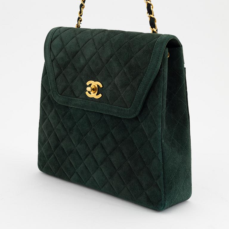 Chanel, a green suede bag with pouch, 1989-1991.