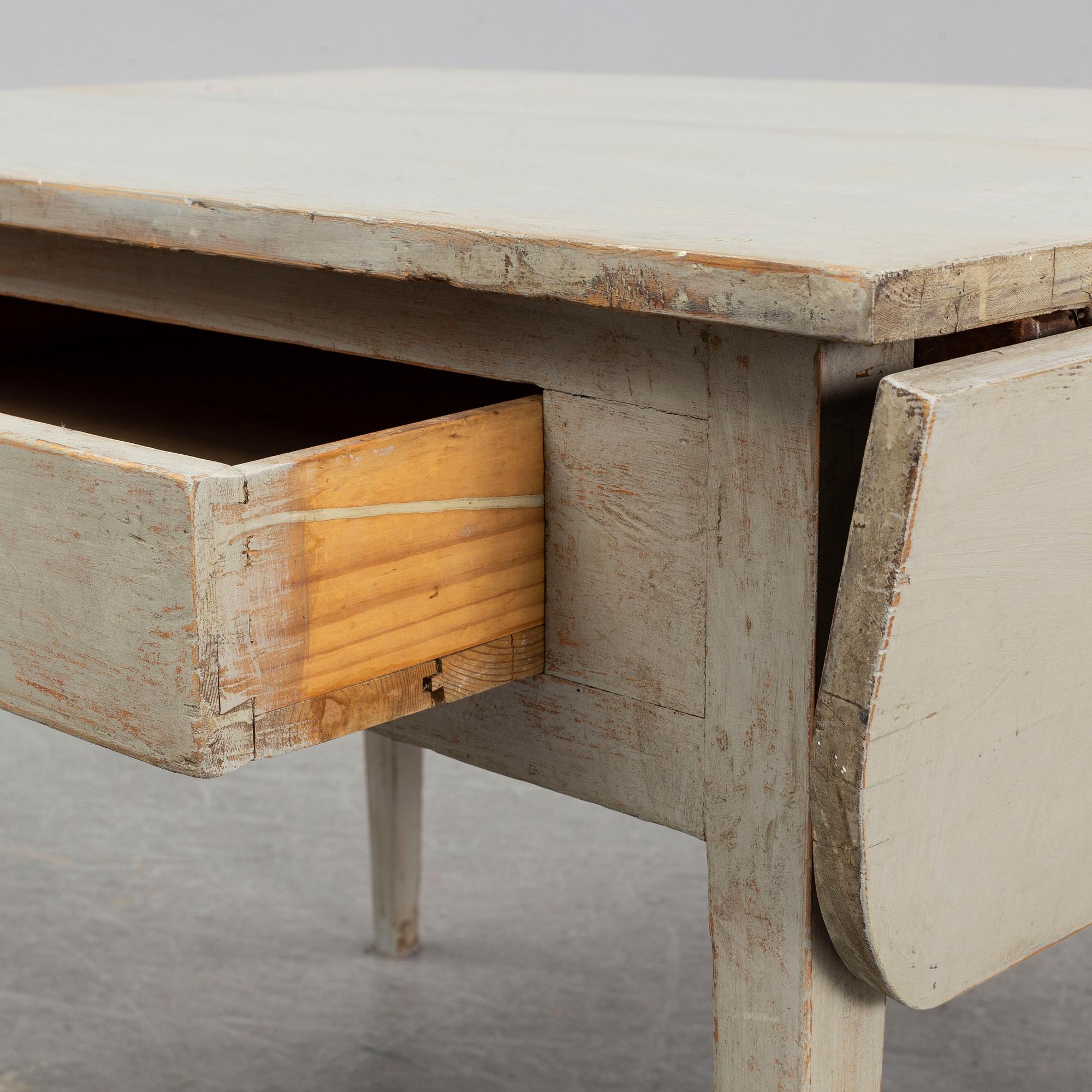 An early 19t Century folding table.