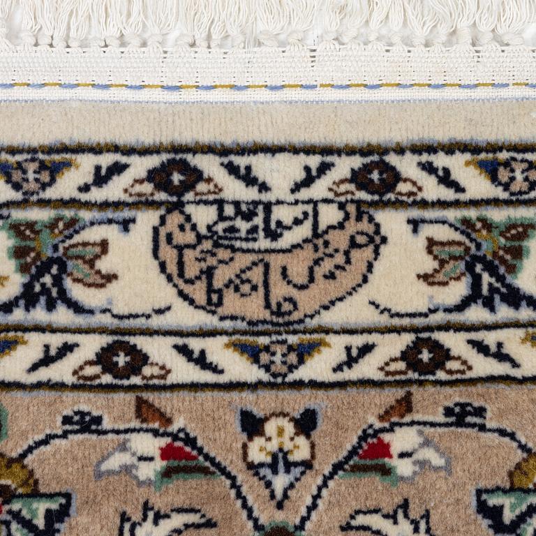 A Keshan carpet, signed, c. 405 x 290 cm.