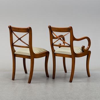 A late 20th century English style dining table and six chairs.