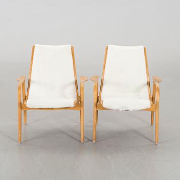 YNGVE EKSTRÖM, a set of two Laminett easy chairs.