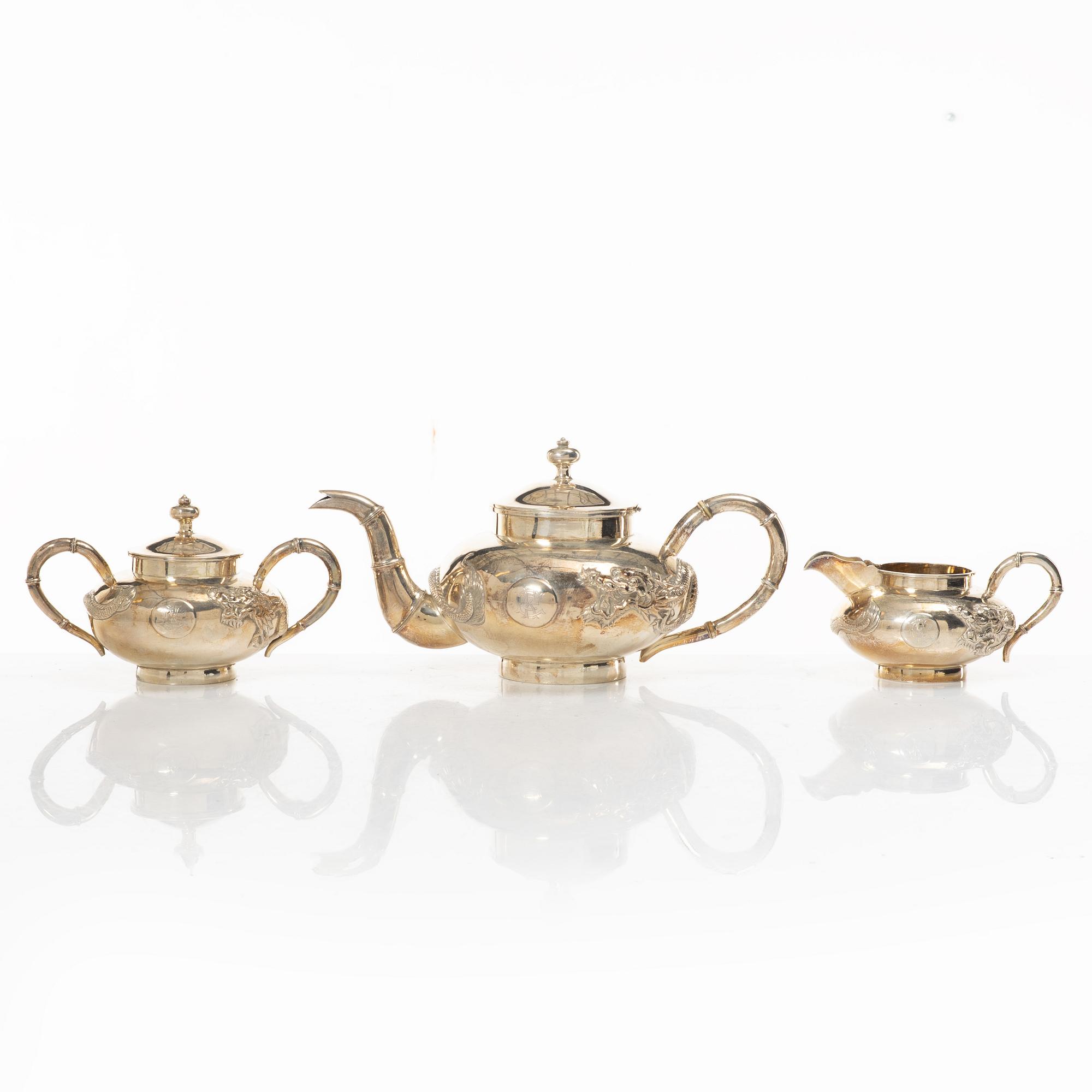 A three-piece Chinese silver tea service, Shanghai, early 20th Century.