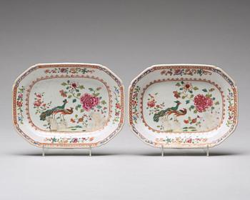 A pair of famille rose 'double peacock' butter tureens with covers and stands, Qing dynasty, Qianlong (1736-95).