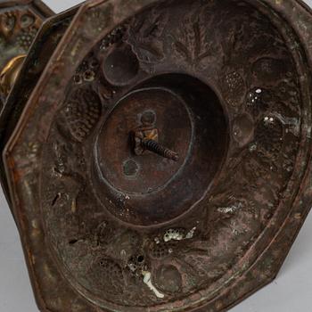 A pair of possibly 17th century brass candlesticks.