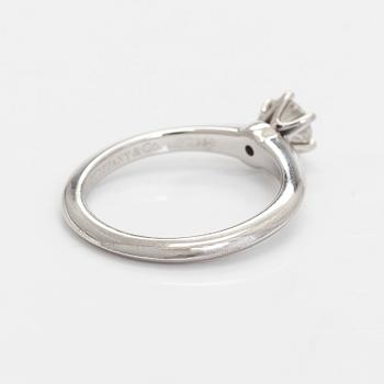 Tiffany & Co, a platinum solitaire ring with a brilliant-cut diamond.