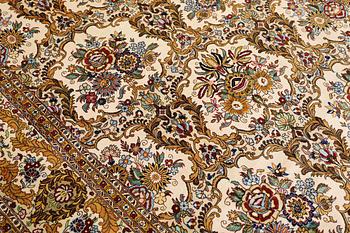 A part silk Ghom carpet, c. 420 x 310 cm.