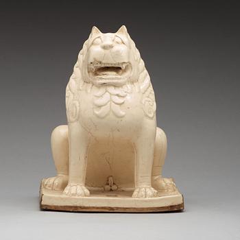 A white glazed seated mythical beast, Qing dynasty, presumably Kangxi (1662-1722).