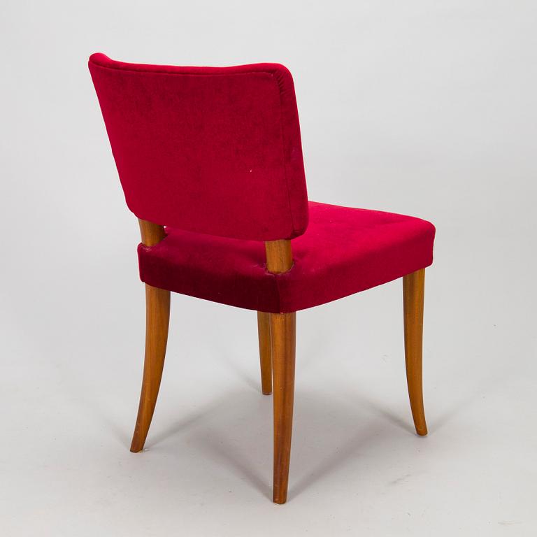 A mid 20th century dining table and a set of four chairs, Oy Boman Ab and two chairs Werner West.