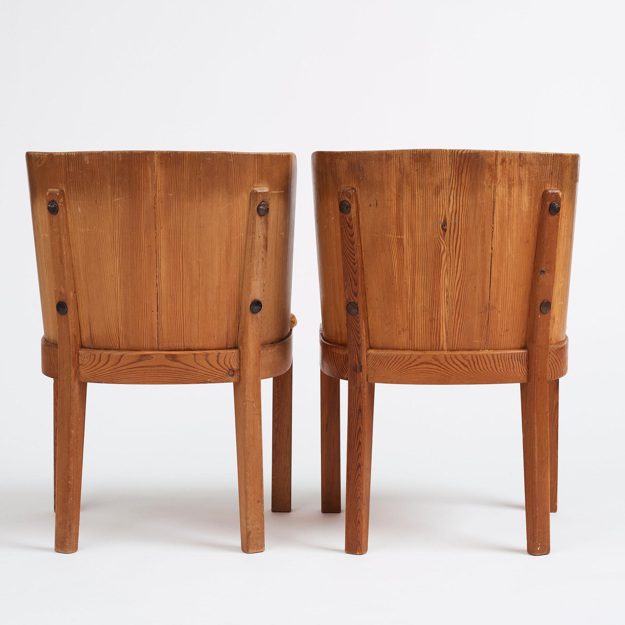 Axel Einar Hjorth, a pair of stained pine 'Lovö' chairs, Nordiska Kompaniet, Sweden 1930s.