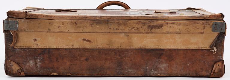 A late 19th cent leather suitcase by Louis Vuitton.